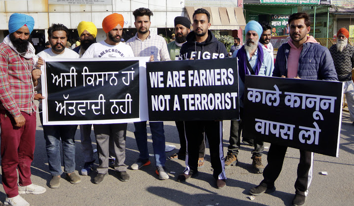 young-men-protesting-for-Indian-farmer-rights